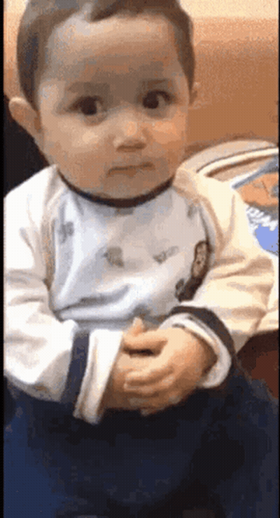 Baby Making Funny Face With Folded Hands GIF