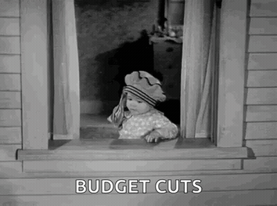 Baby Peeking Out Window Saying Budget Cuts GIF
