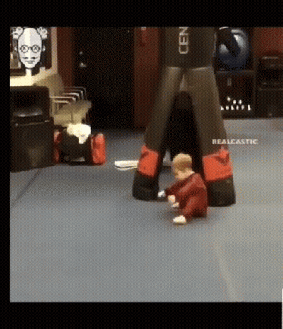 Baby Playing With Boxing Bag GIF