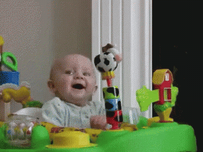Baby Playing With Cow Toy GIF