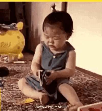 Baby Playing With Toy Funny Face GIF