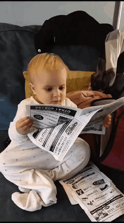 Baby Reading Buffet Newspaper GIF