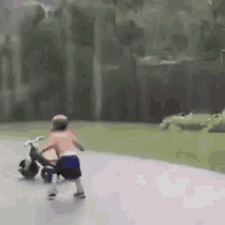 Baby Riding His Bike Dancing In The Rain GIF