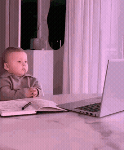 Baby Sitting At Desk With Laptop GIF