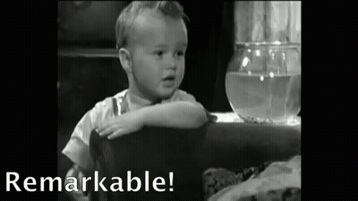Baby Sitting At Table With Fish Bowl GIF