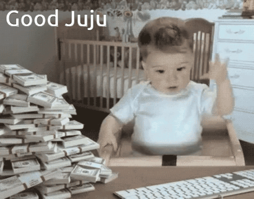 Baby Sitting In Front Of Money Giving Middle Finger GIF
