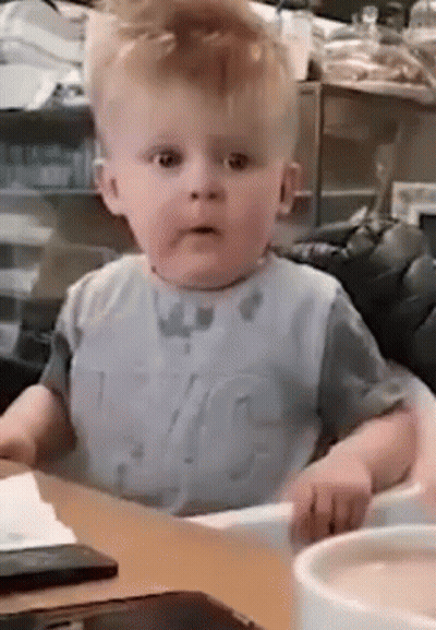 Baby Sitting In High Chair With Coffee GIF