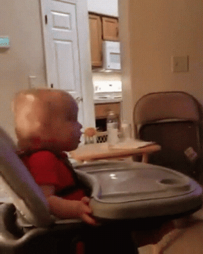 Baby Sitting In High Chair With Tray GIF