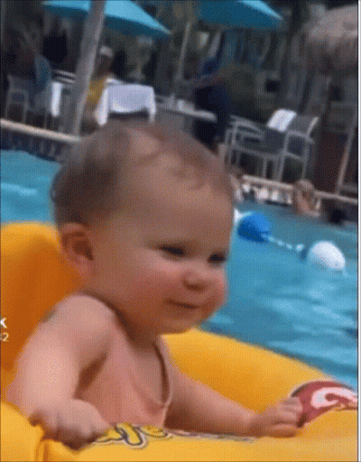 Baby Sitting In Inflatable Raft In Pool GIF