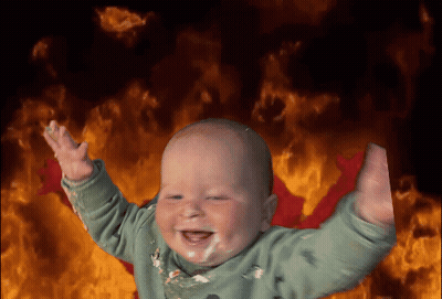 Baby Smiling In Front Of Flames GIF
