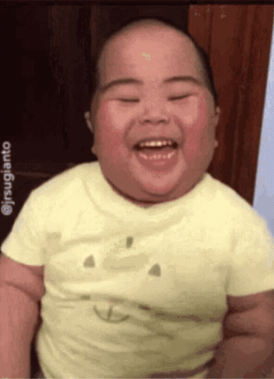 Baby Smiling In Yellow Smiley Shirt GIF