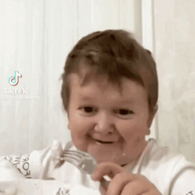 Baby Smiling With Fork In Mouth GIF