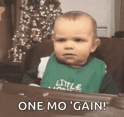 Baby Statue In Bib Saying I Love King Cake GIF