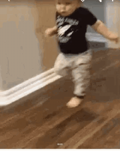 Baby Walking On Floor Holding Toilet Paper GIF