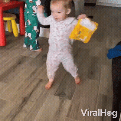 Baby Walking With Yellow Toy Bucket GIF