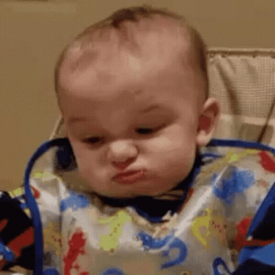 Baby Wearing Bib Making Funny Face GIF