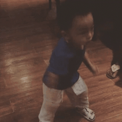 Baby Wearing Cute Since Day 1 Shirt On Couch GIF