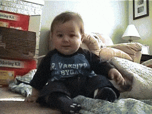 Baby Wearing Shirt That Says Varsity Byga GIF