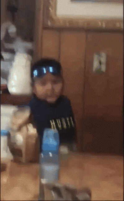 Baby Wearing Sunglasses And Hustle Shirt GIF