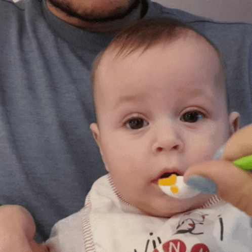 Baby With Bib Saying N GIF