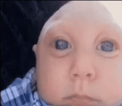 Baby With Blue Eyes Looking At Camera GIF
