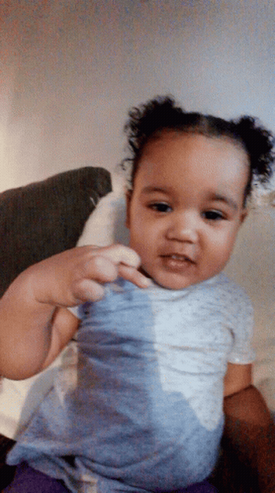 Baby With Curly Hair Sitting GIF