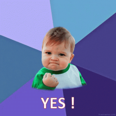 Baby With Fist In The Air Saying Yes GIF