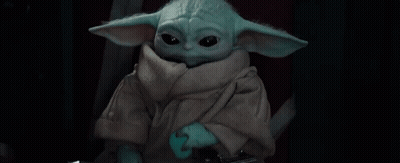 Baby Yoda Holding Sword Looking At Camera GIF