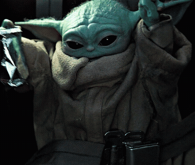 Baby Yoda Sitting in Car Seat Holding Foil