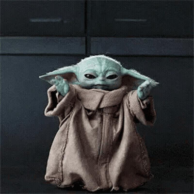 Baby Yoda Standing In Front Of Dark Background GIF