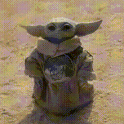 Baby Yoda Statue Standing On Sand GIF