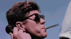 Back And To The Left JFK Smoking Cigar GIF