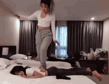 Back Massage Hotel Bed Stepping Foot Funny Girls GIF