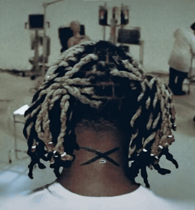 Back of Head With Dreadlocks and X on Neck