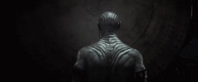 Back Of Man With Tattoo Saying W GIF