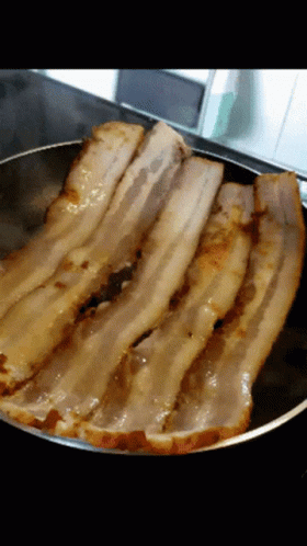 Bacon Slices Cooking In A Pan GIF