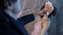 Bad Comedian Throwing Money To Mannequin GIF