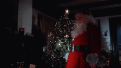 Bad Santa Holding A Knife GIF
