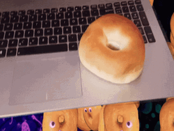 Bagel Bread On Top Of Laptop GIF