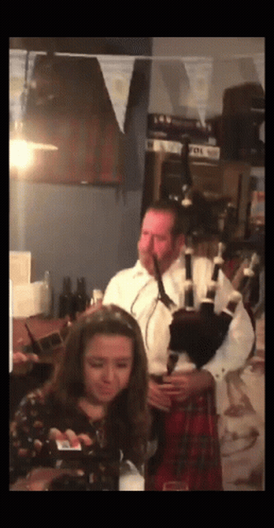 Bagpiper With Men In Hats And Kilts GIF