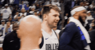 Bald Basketball Player In Dallas Jersey Talking To Another Player GIF