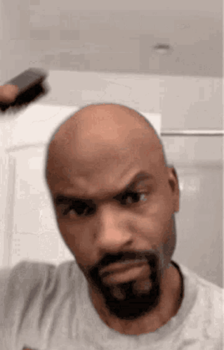 Bald Bearded Man Brushing Hair GIF