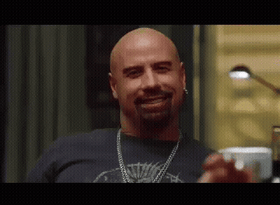 Bald Bearded Man In Black Shirt And Chain GIF