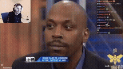 Bald Bearded Man Sitting In Front Of Screen GIF