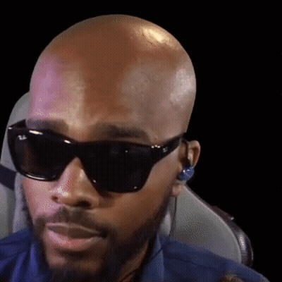 Bald Bearded Man Wearing Sunglasses And Earbuds GIF
