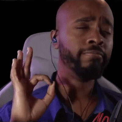 Bald Bearded Man With Ear Buds Making OK Sign GIF