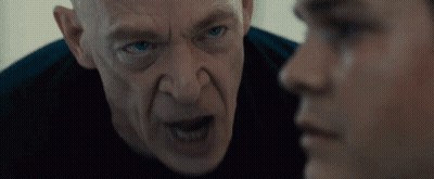 Bald Blue-Eyed Man Looking At Another Man GIF
