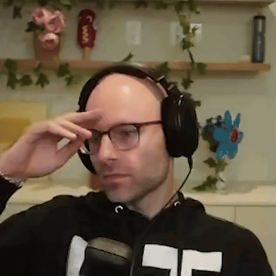 Bald Man Adjusting Headphones And Glasses GIF