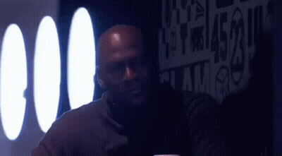 Bald Man At Table With Jordan Sign GIF