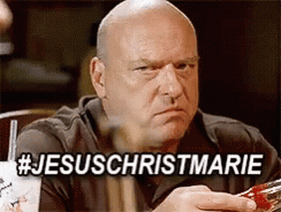 Bald Man At Table With Sign Saying Jesus Christmarie GIF
